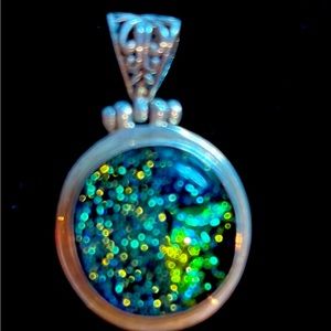 Sterling silver pendant with sparkly glass inset